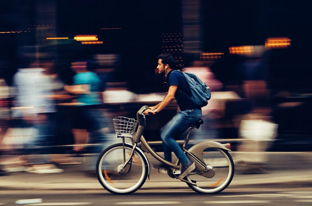 A man moving alone on the street.