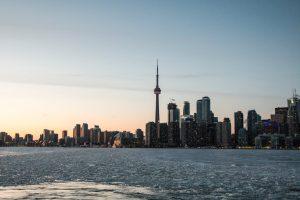 A photo of some landmarks in Toronto in the early evening.