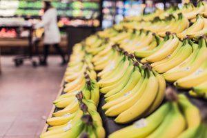 A close up of bananas in a supermarket. 