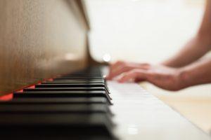 A person playing a piano. 