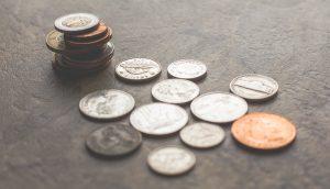 quarters on a table ready for a yard sale