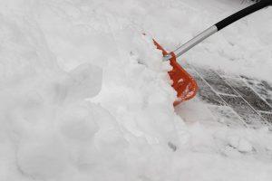 cleaning snow with a showel