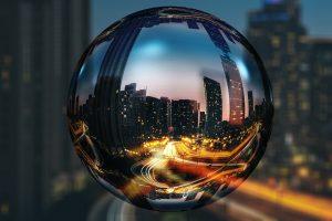 A street in Toronto during the night seen through a globe made of glass. 