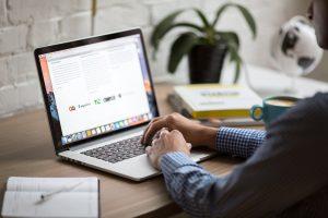 A man using laptop to create moving timeline