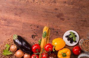 Food on a table (tomatoes, eggplant, paprika)