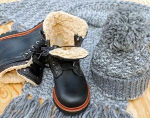 Winter boots and a cap. To pack bulky winter clothes takes some preparation.