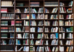 Shelves in a bookstore where you can find free moving boxes. 