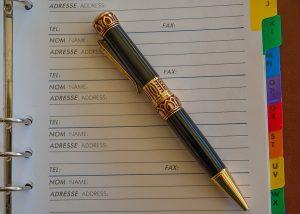 A pen on an address book.